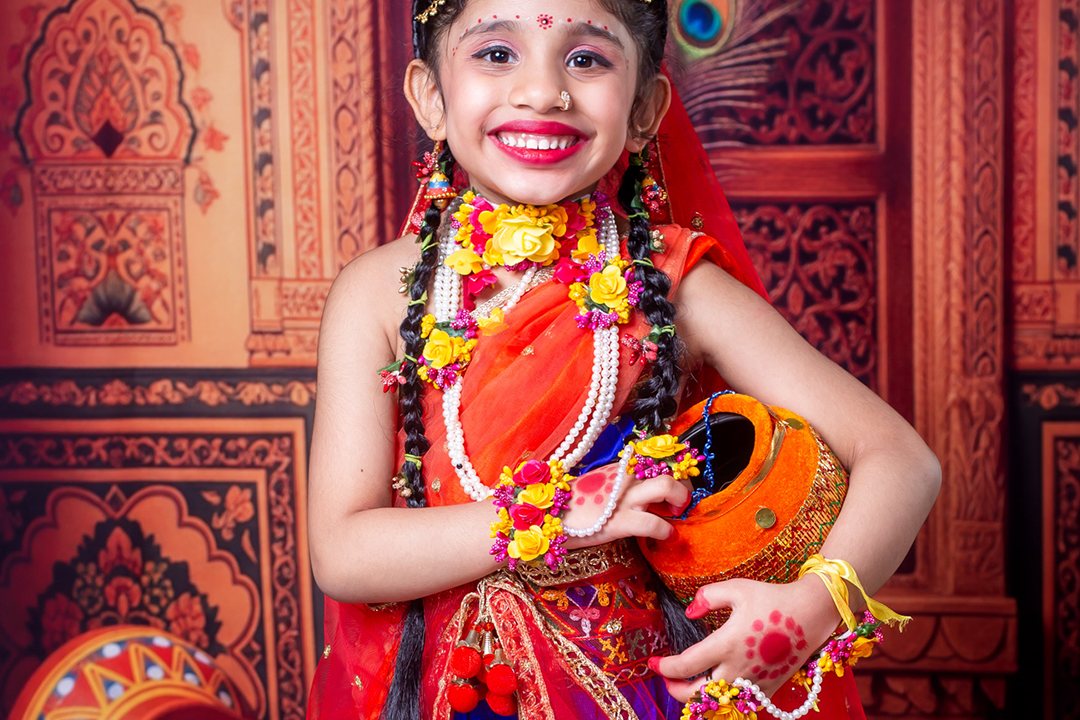 A child dressed as Radha
