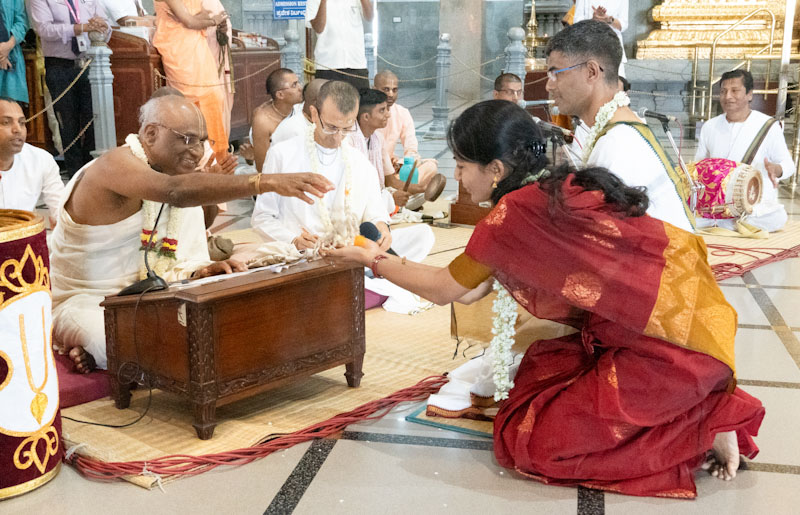 Devotees receiving Tulasi Japa Mala